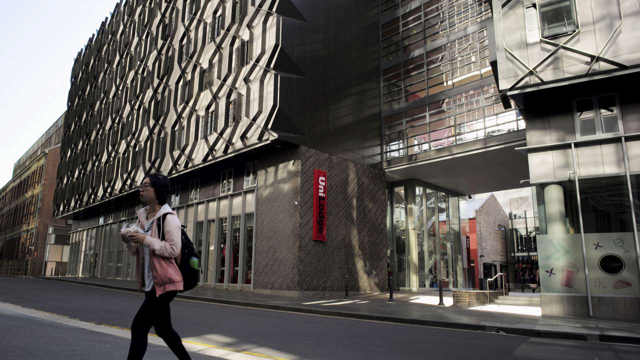 FILE PHOTO: A student walks from high density housing near the campus of the University of Technology in Sydney