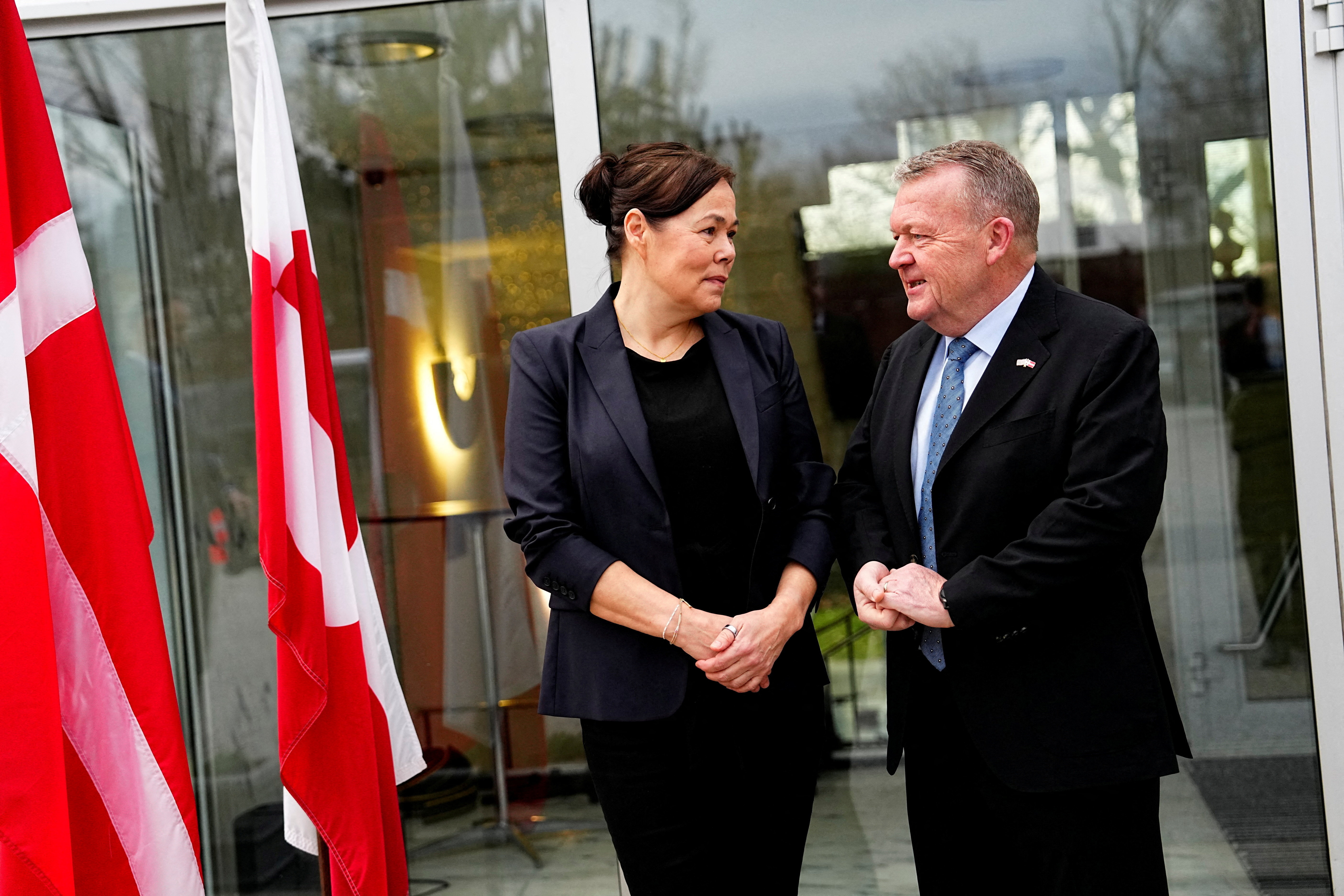 Denmark's Foreign Minister Lars Loekke Rasmussen and Greenland's Foreign Minister Vivian Motzfeldt prepare for meeting at the White House