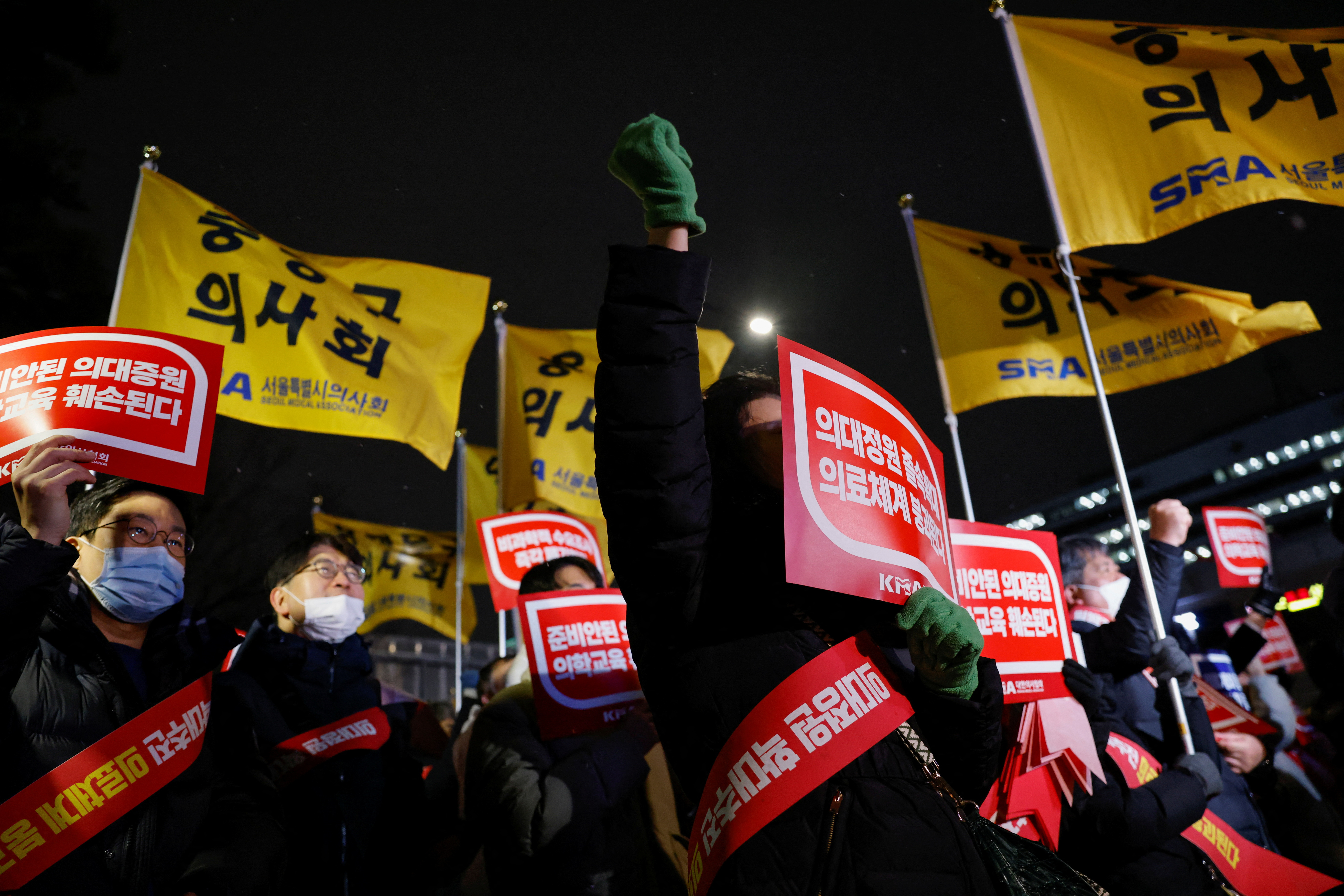 Doctors take part in a protest against a plan to admit more students to medical school, in front of the Presidential Office in Seoul