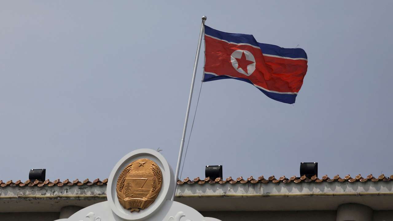 FILE PHOTO: The North Korean flag flutters at the North Korea consular office in Dandong