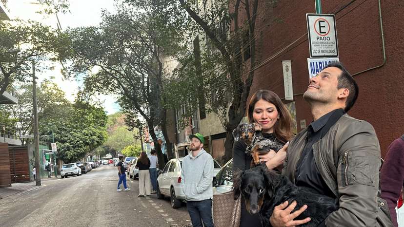 FILE PHOTO:People wait outside their homes and buildings in Mexico City