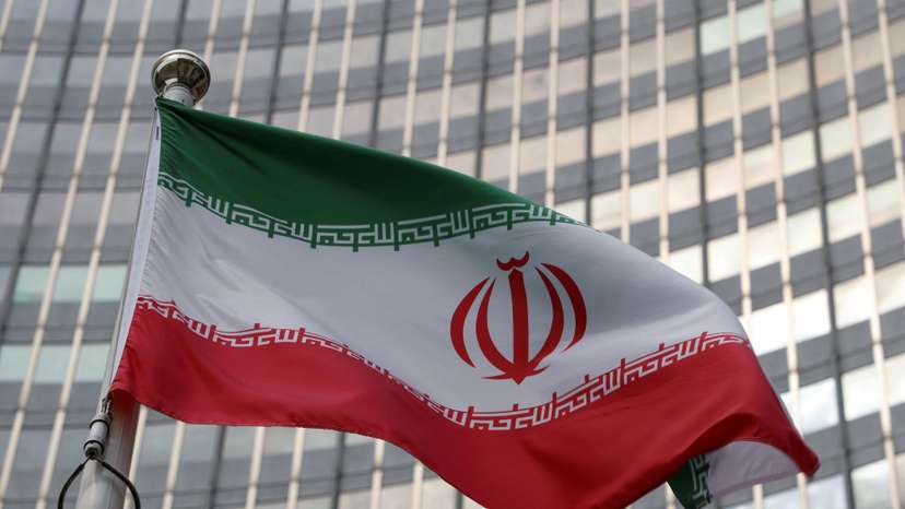 The Iranian flag flutters in front of the International Atomic Energy Agency (IAEA) organisation's headquarters in Vienna