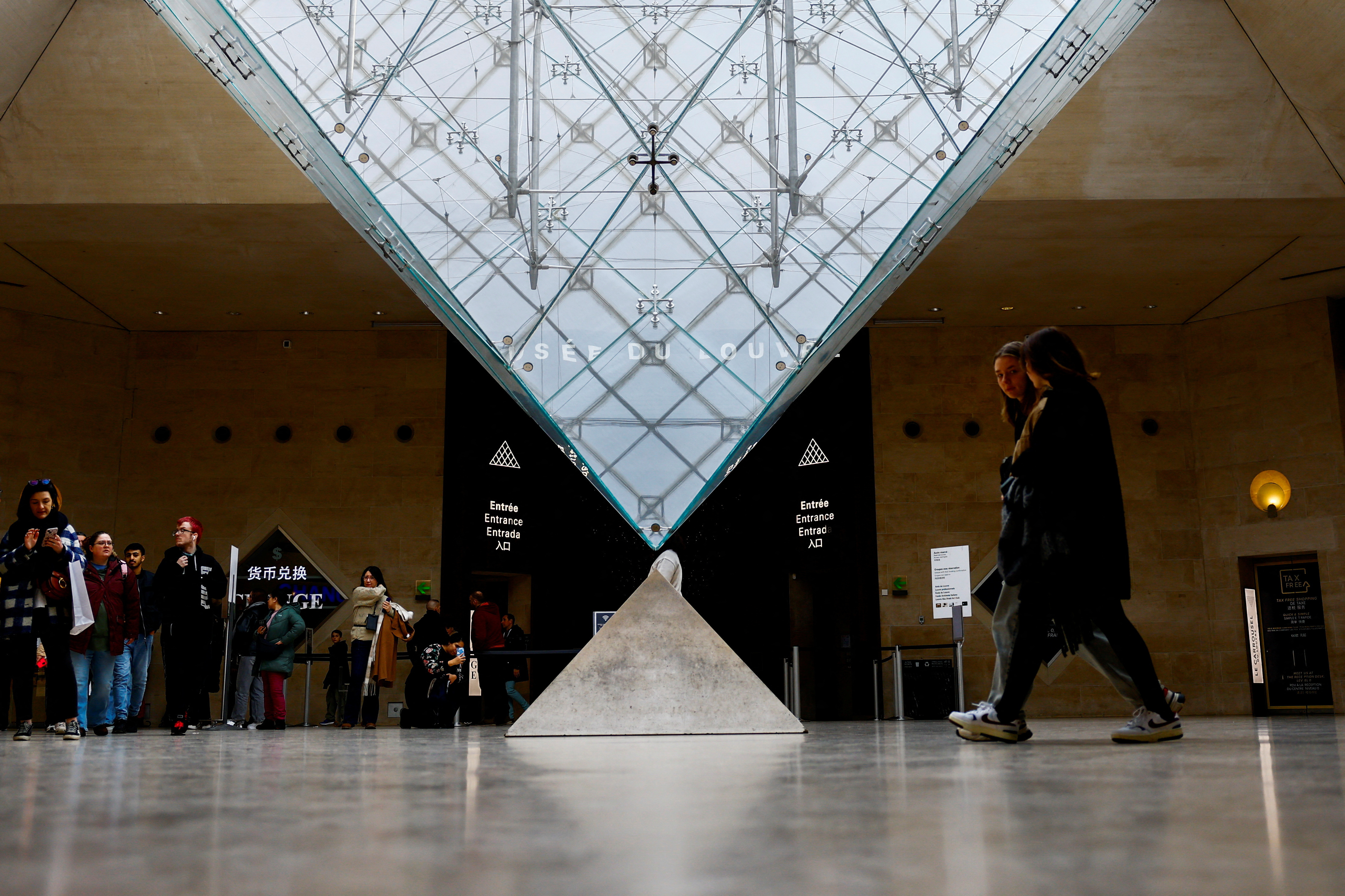 Tourists at the Louvre Museum in Paris
