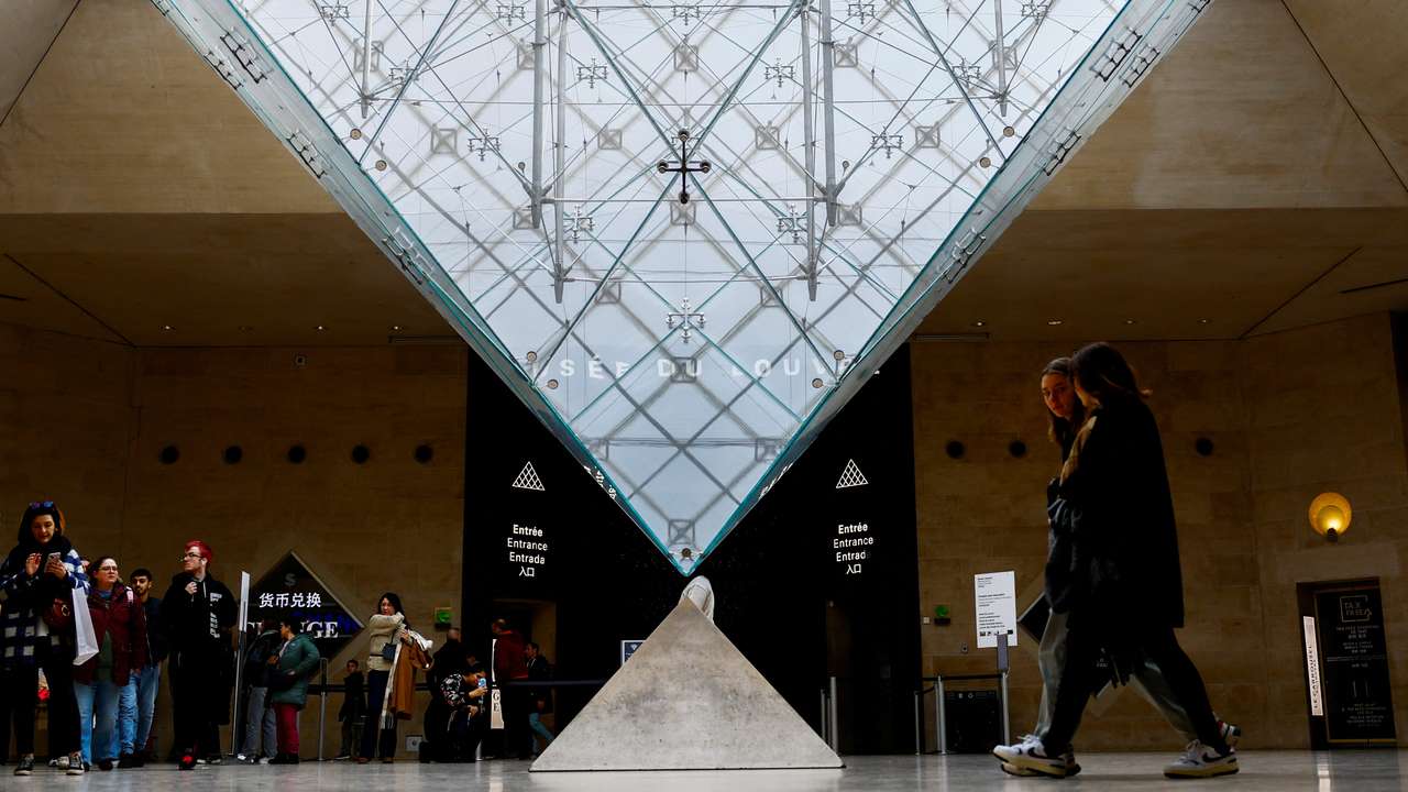 Tourists at the Louvre Museum in Paris