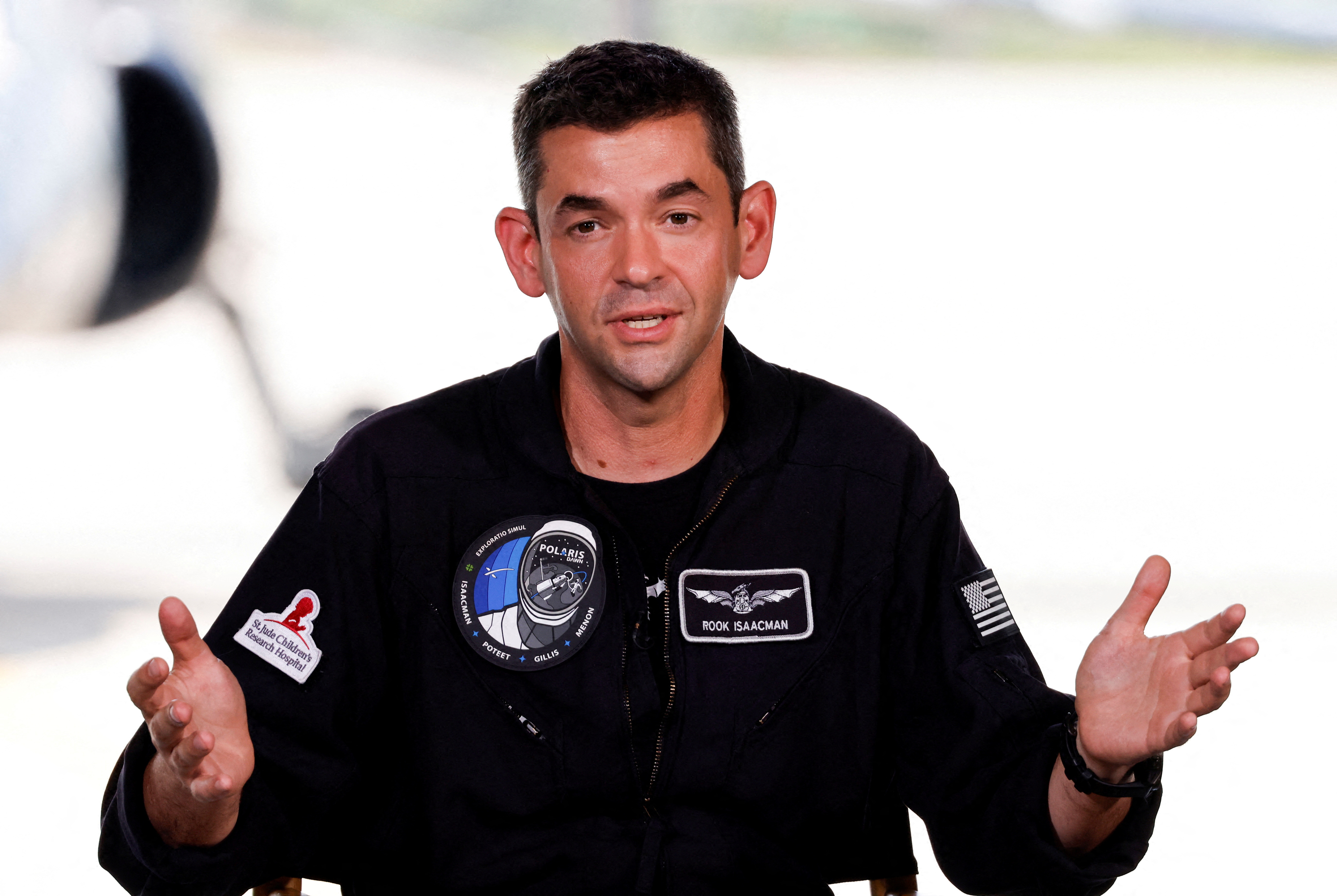 FILE PHOTO: Commander Jared Isaacman of Polaris Dawn, a private human spaceflight mission, speaks at a press conference prior to launch.