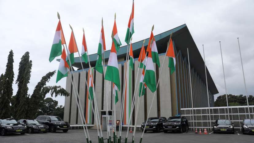 Ivory Coast's flags are pictured next to the presidential palace during the ceremony to commemorate the country's 60th Independence Day, in Abidjan