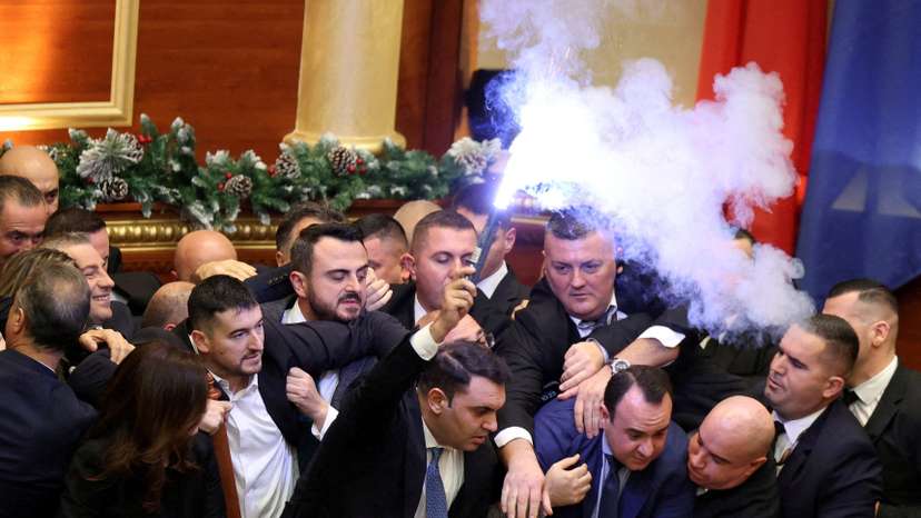 Members of parliament from the Democratic Party, Albania's biggest opposition party protest inside the parliament