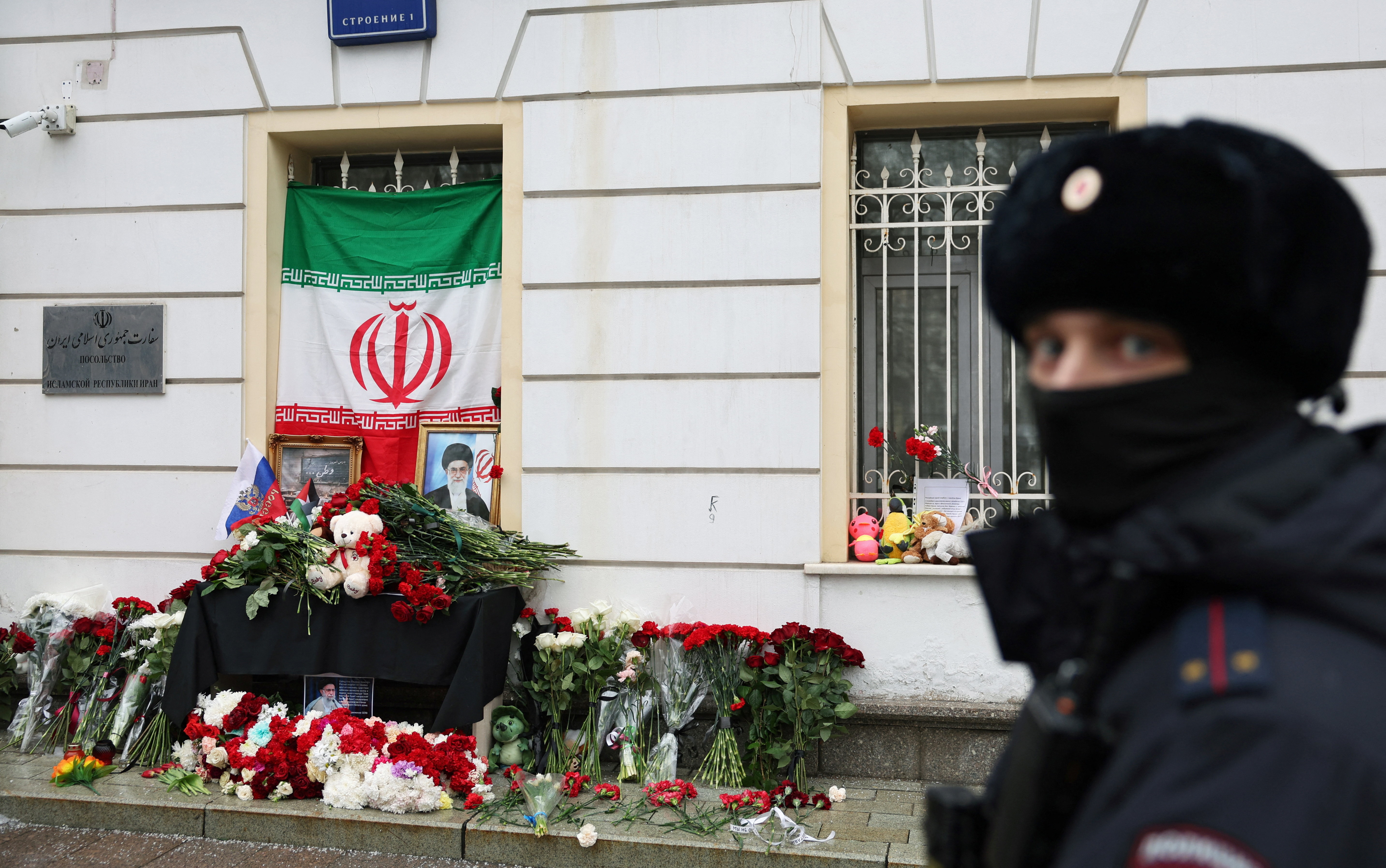 People bring flowers to the Iranian embassy in Moscow