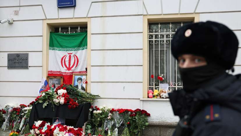 People bring flowers to the Iranian embassy in Moscow