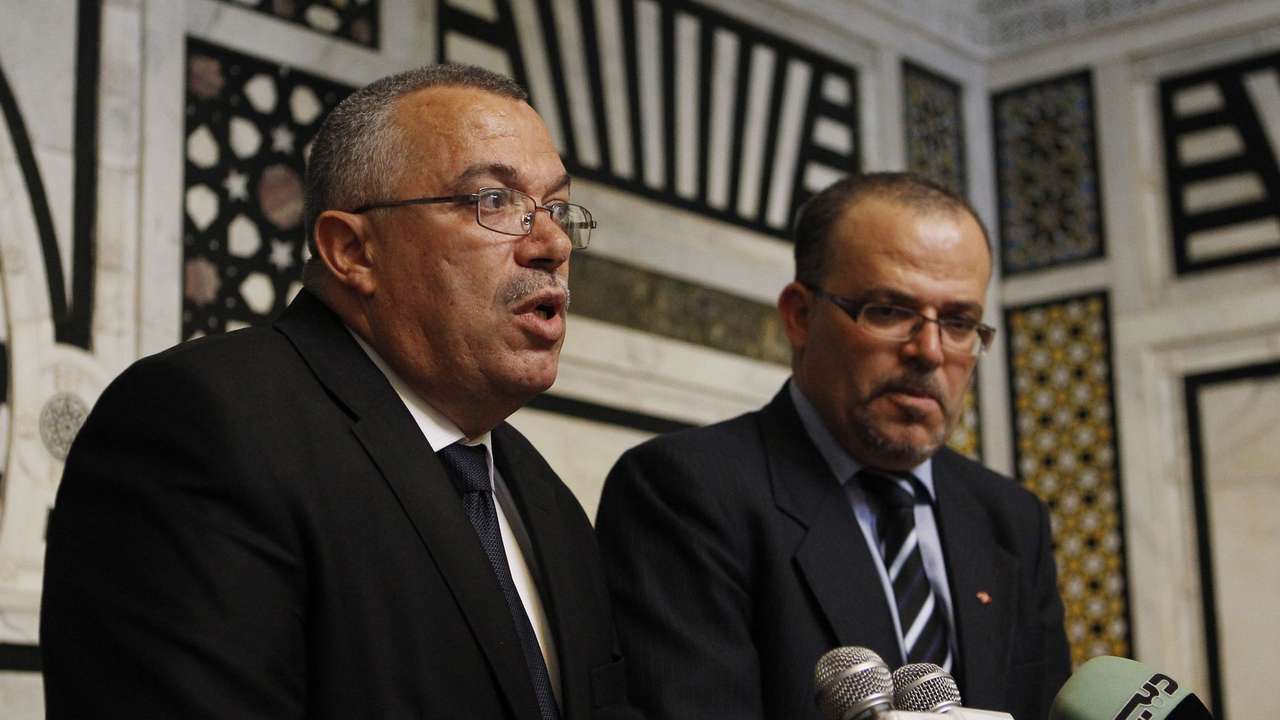 Tunisia's Justice Minister Bhiri and Human Rights Minister Dilou speak at a news conference in Tunis