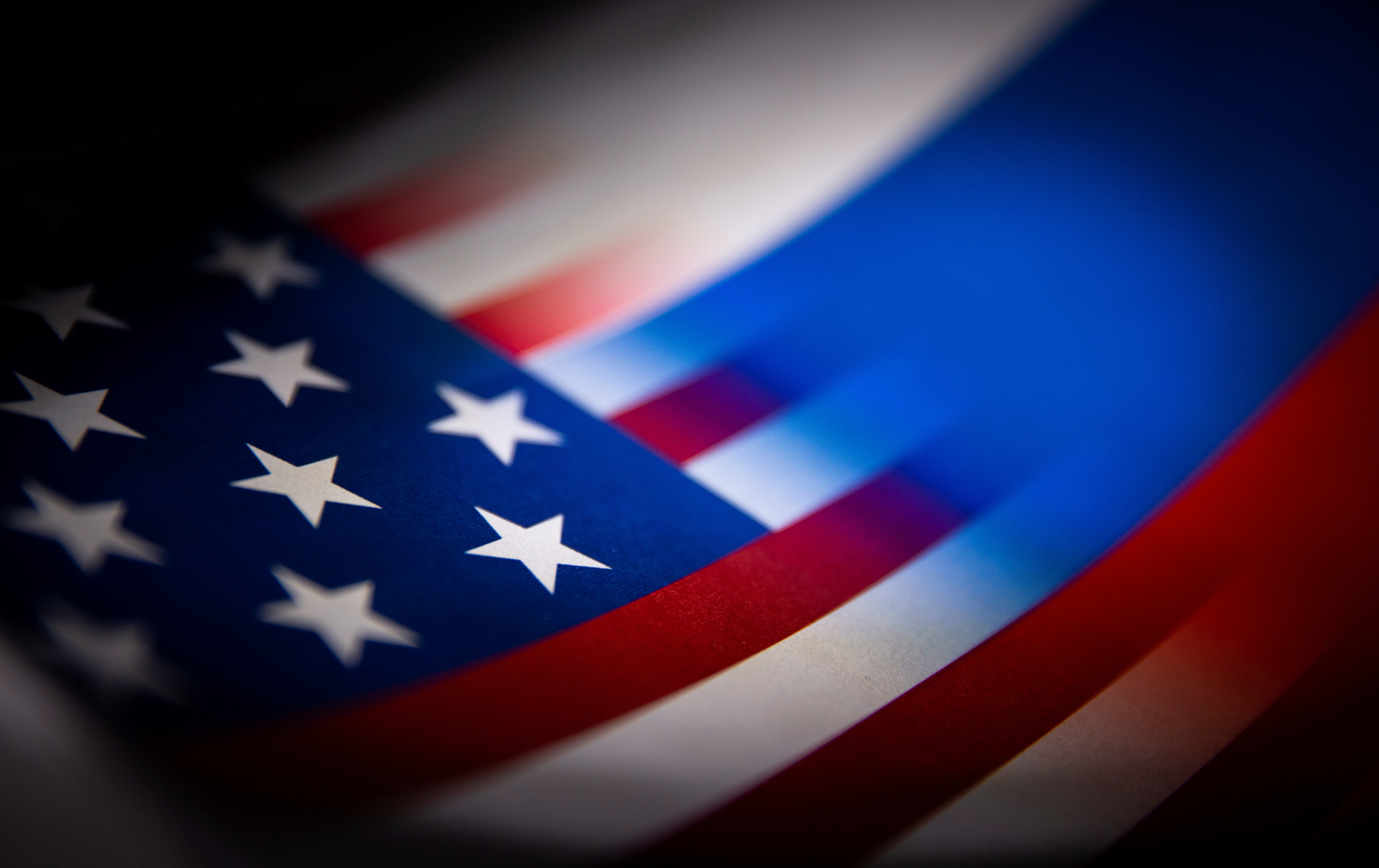 Illustration shows U.S. and Russian flags