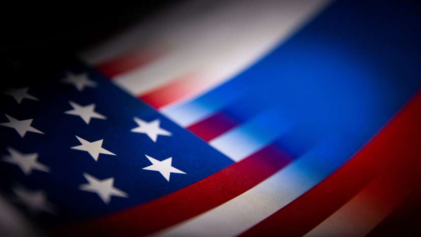 Illustration shows U.S. and Russian flags