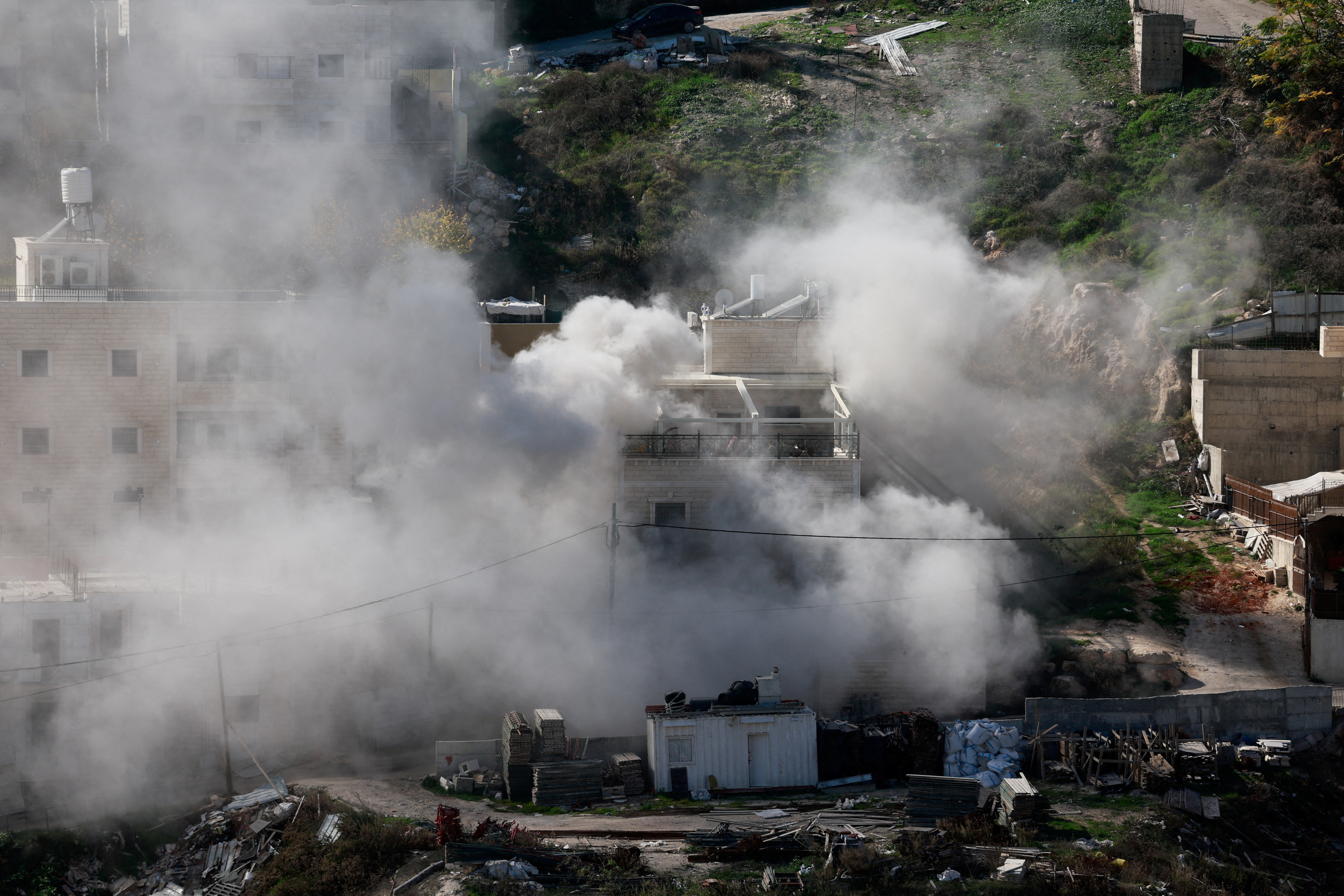 Israeli forces demolish the home of two Hamas gunmen, in East Jerusalem