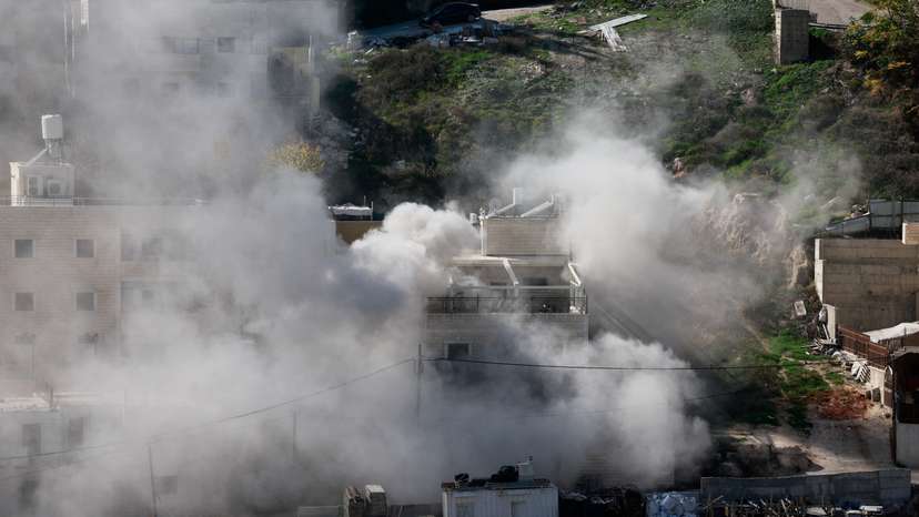 Israeli forces demolish the home of two Hamas gunmen, in East Jerusalem