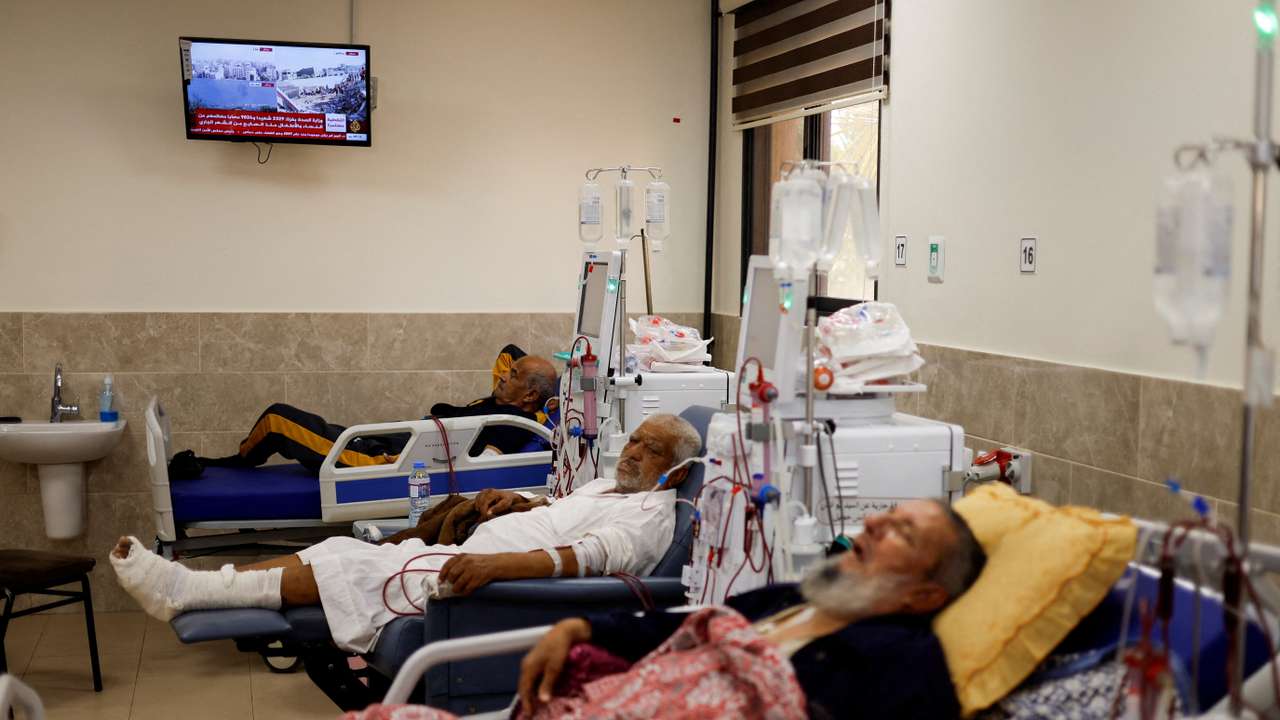 Palestinian kidney patients lie on hospital beds as health officials say they are running out of fuel to operate dialysis devices, amid the ongoing Israeli-Palestinian conflict, at Naser hospital in Khan Younis