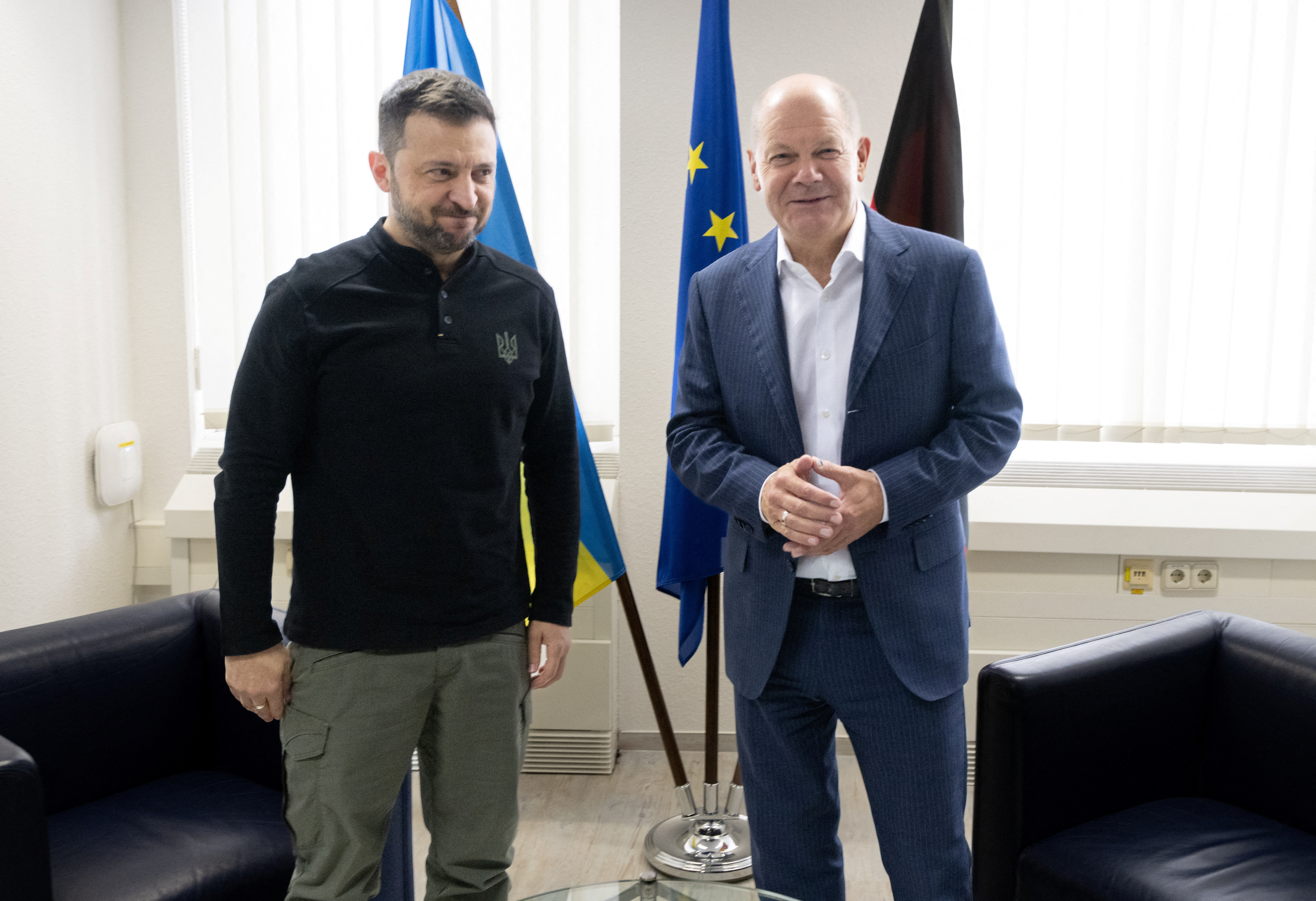 German Chancellor Olaf Scholz and Ukrainian President Volodymyr Zelenskiy meet at the airport in Frankfurt