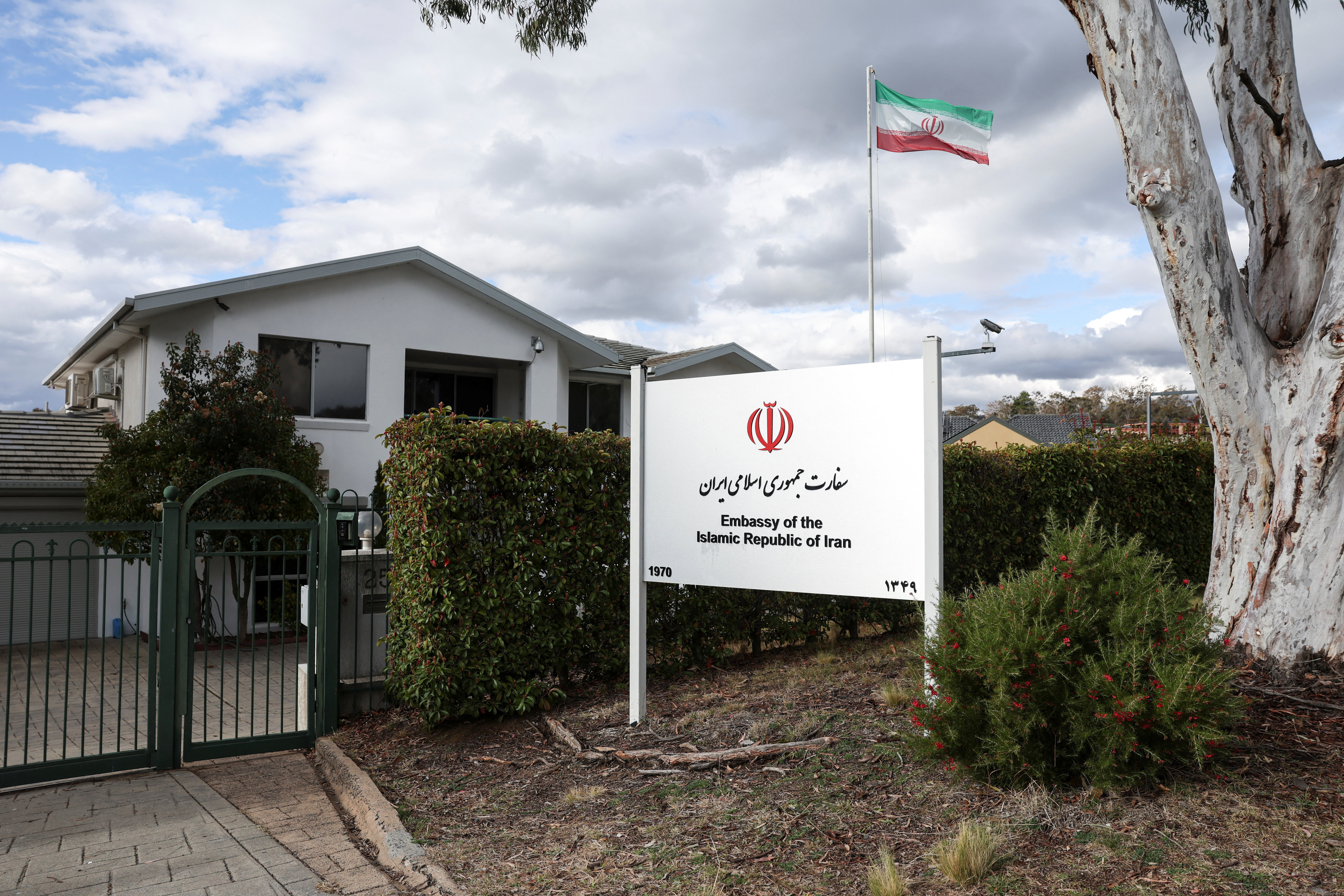 An Iranian flag flutters outside the Embassy of the Islamic Republic of Iran, in Canberra