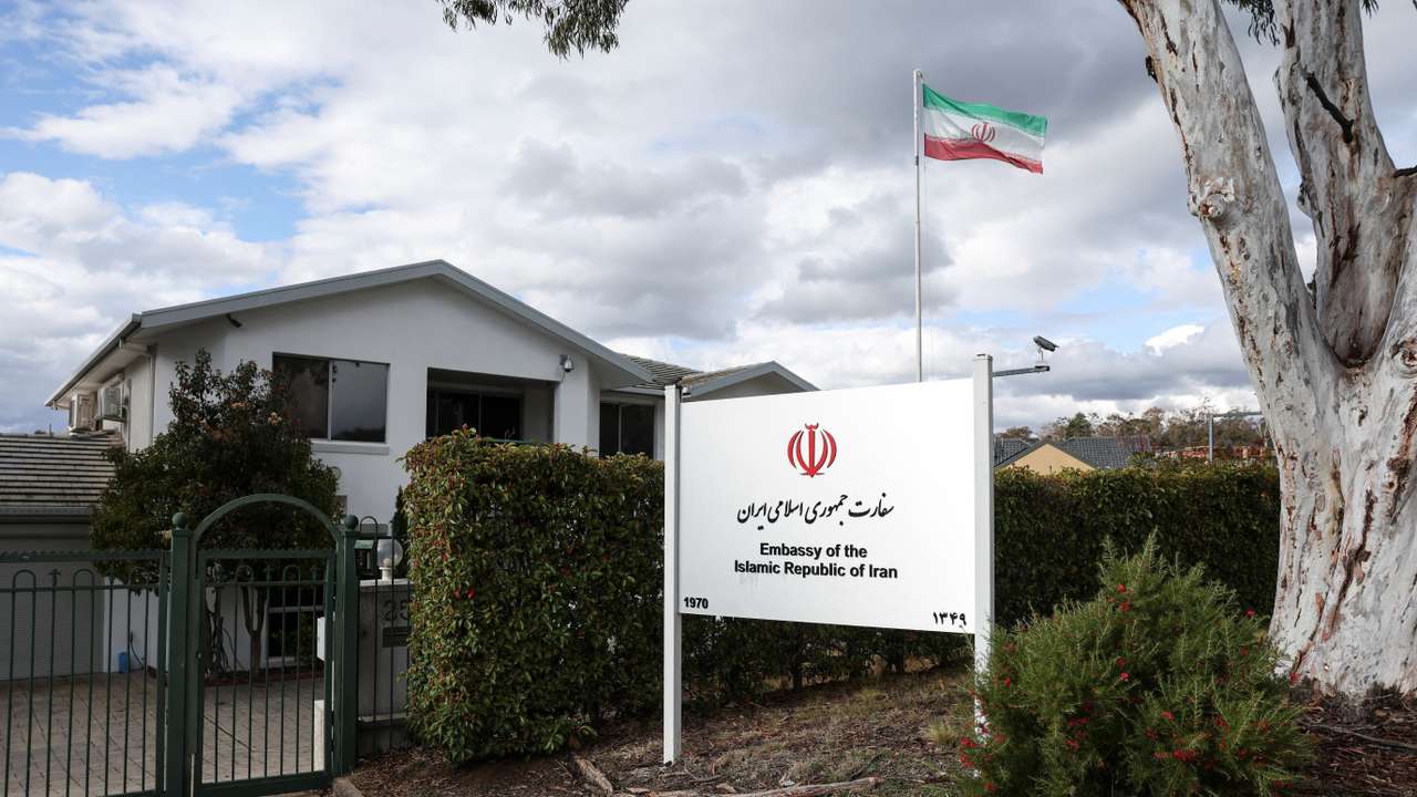 An Iranian flag flutters outside the Embassy of the Islamic Republic of Iran, in Canberra