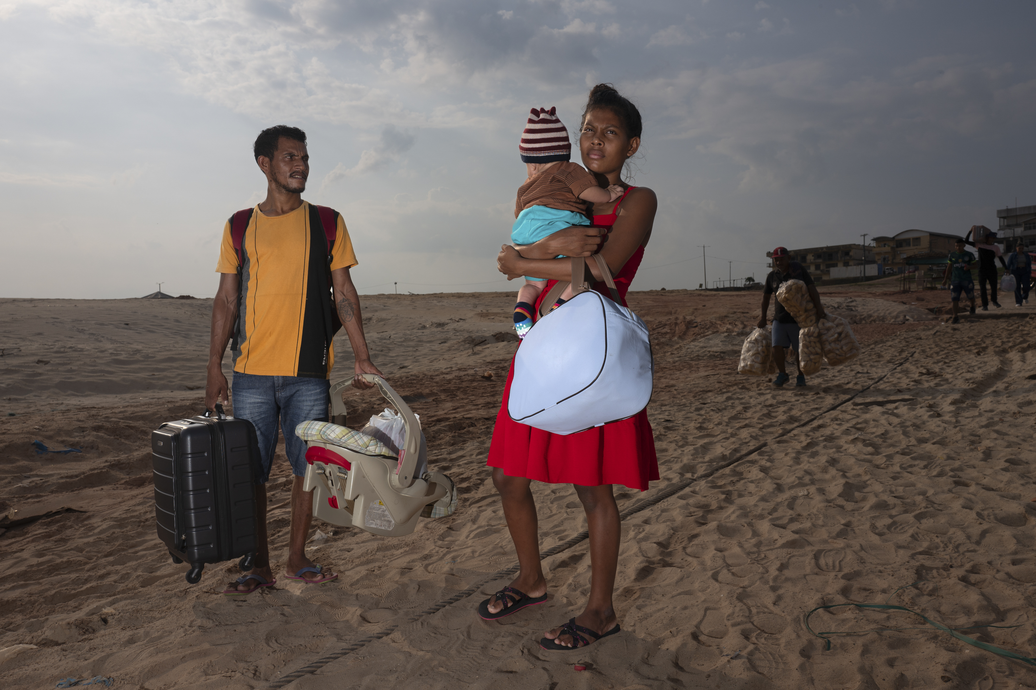 Tefé, Amazonas - Sept 20, 2024. Josiane and her family from the remote region of Fonte Boa search for a boat along the dried banks of Lake Tefé after traveling for hours to collect emergency government aid in response to the Amazon’s historic drought. River travel has become nearly impossible, disrupting daily life across the region. now a quick caption for this, adding the info and day