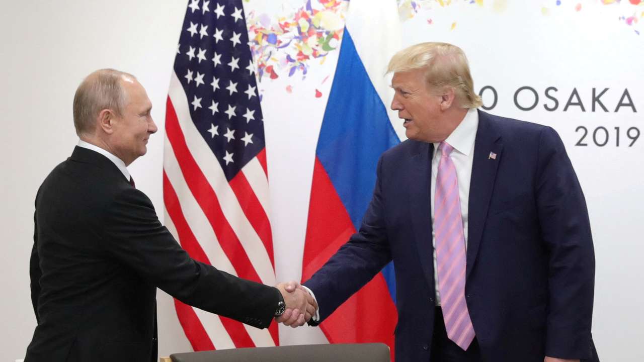 FILE PHOTO: Russia's President Vladimir Putin and U.S. President Donald Trump attend a meeting on the sidelines of the G20 summit in Osaka