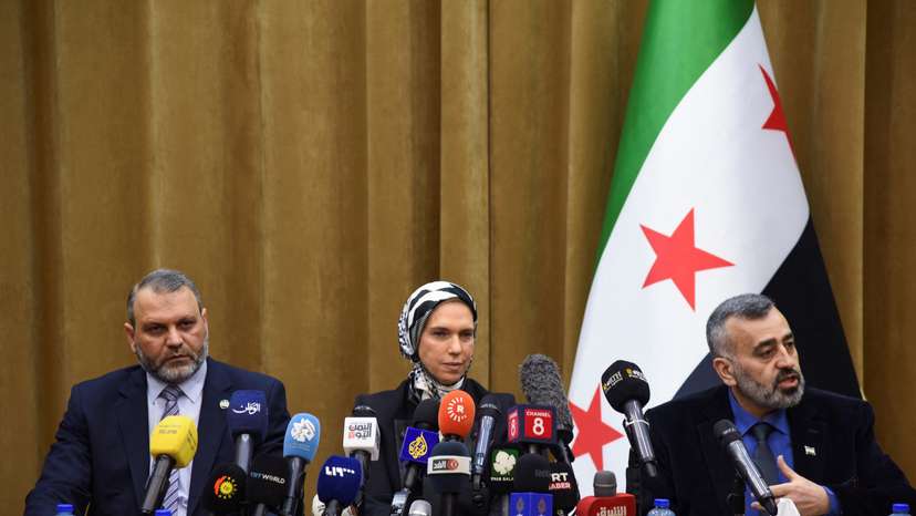 Mustafa al-Moussa, Houda Atassi, and Hassan al-Dughaim attend a press conference in Damascus