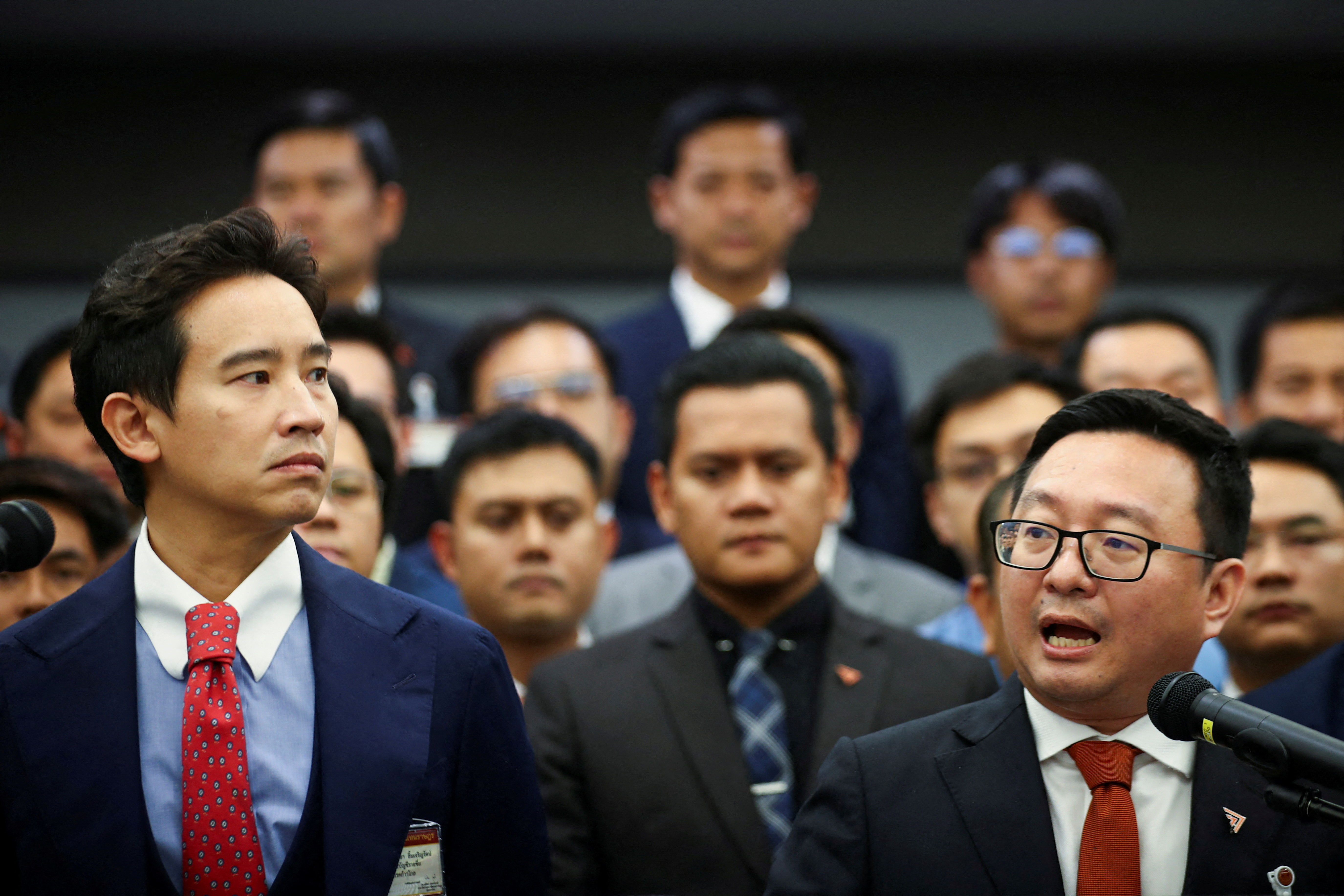 FILE PHOTO: Former Move Forward Party leader Limjaroenrat and Move Forward Party leader Tulathon react during a presser after Thailand's Constitutional Court delivered its verdict on the election winner's bid to amend a law against insulting the monarchy,