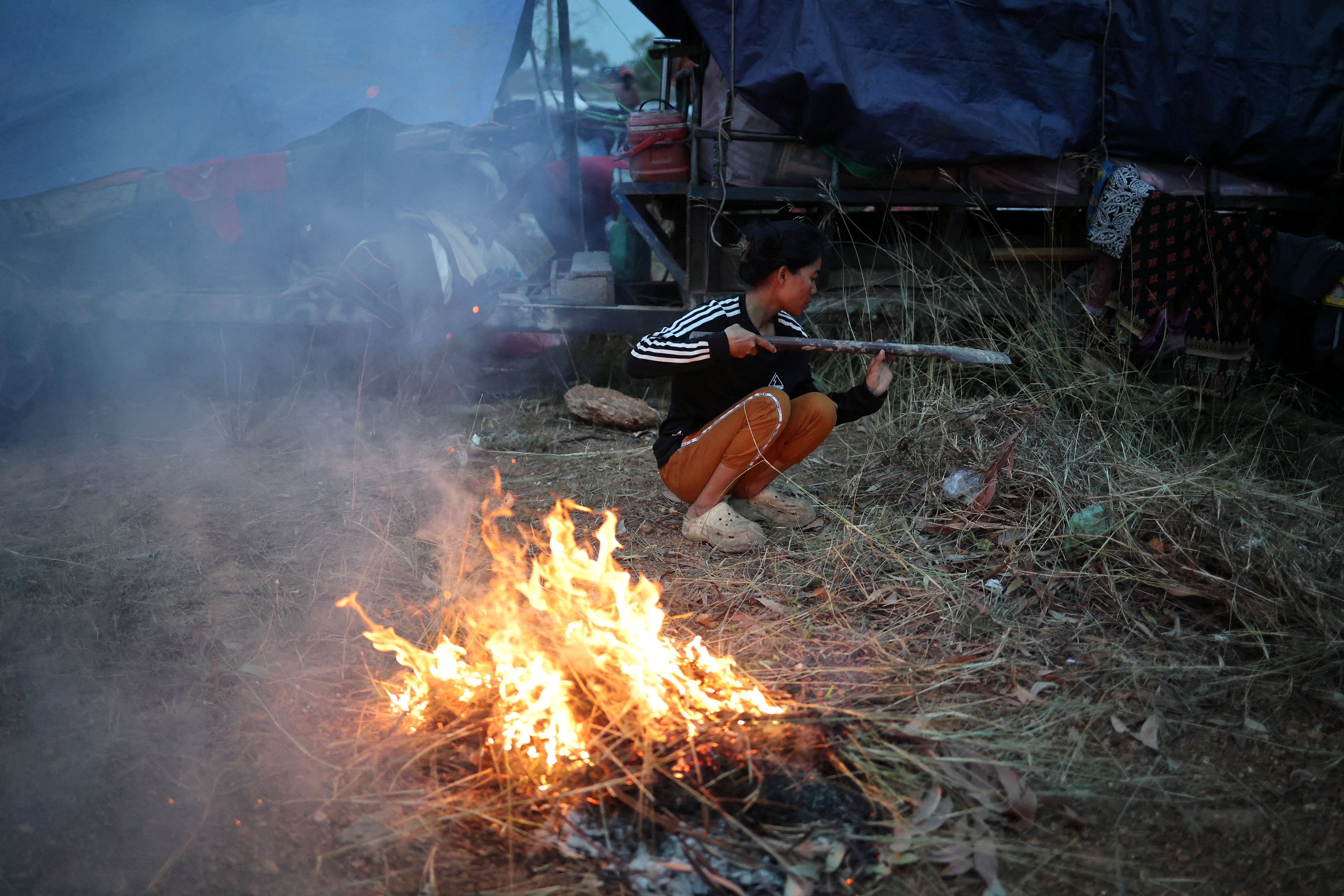 People gather at a refugee camp after evacuation, in Srei Snam
