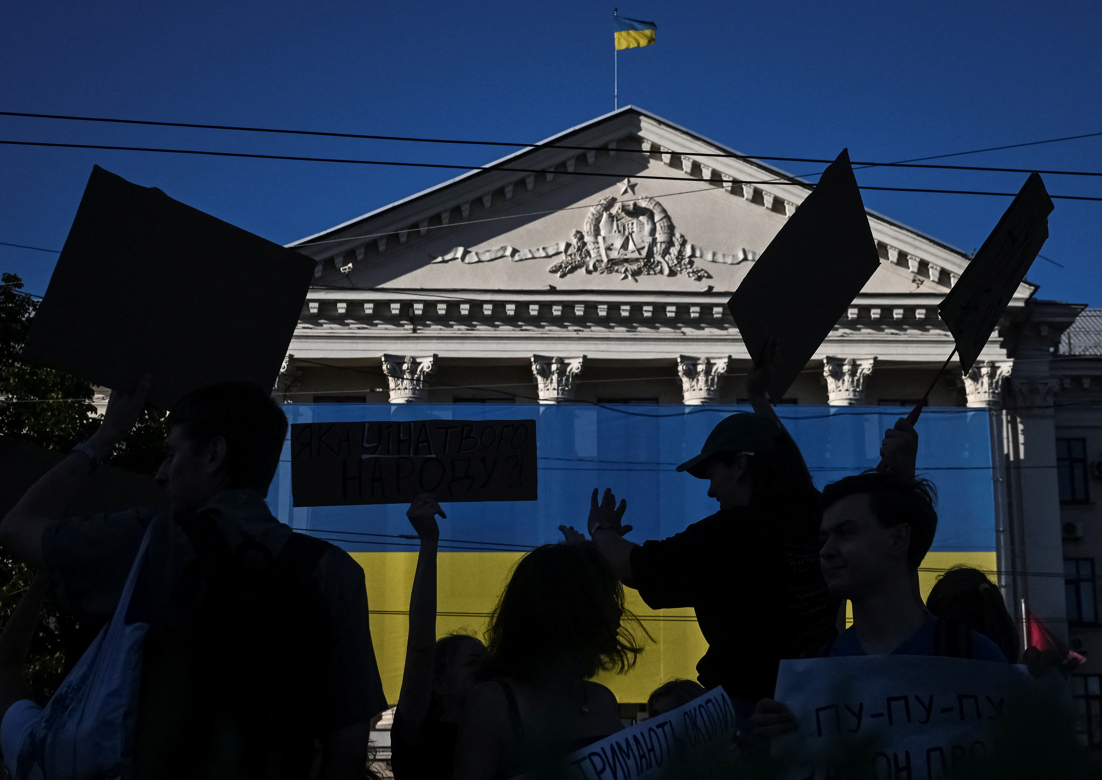 Ukrainians protest against a newly passed law, which curbs independence of anti-corruption institutions in Zaporizhzhia