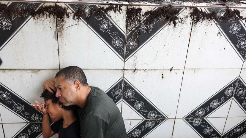 People attend the funeral of 11-year-old Bernardo Lopes Dutra, one of the victims of heavy rains in Juiz de Fora