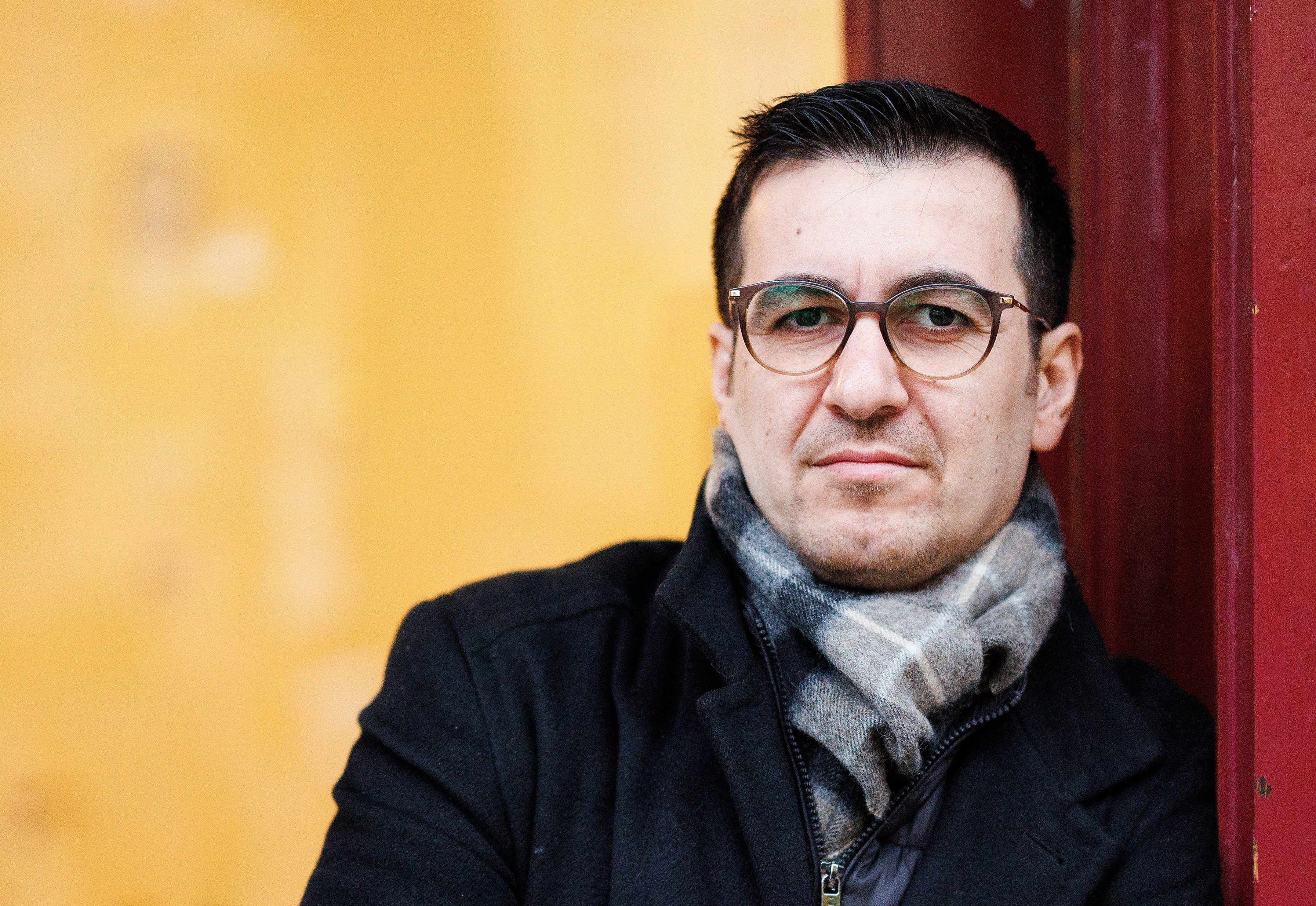 Jian Omar, a German politician of Kurdish-Syrian background, poses in front of his constituency office in Berlin