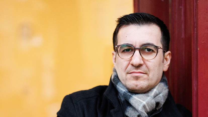 Jian Omar, a German politician of Kurdish-Syrian background, poses in front of his constituency office in Berlin