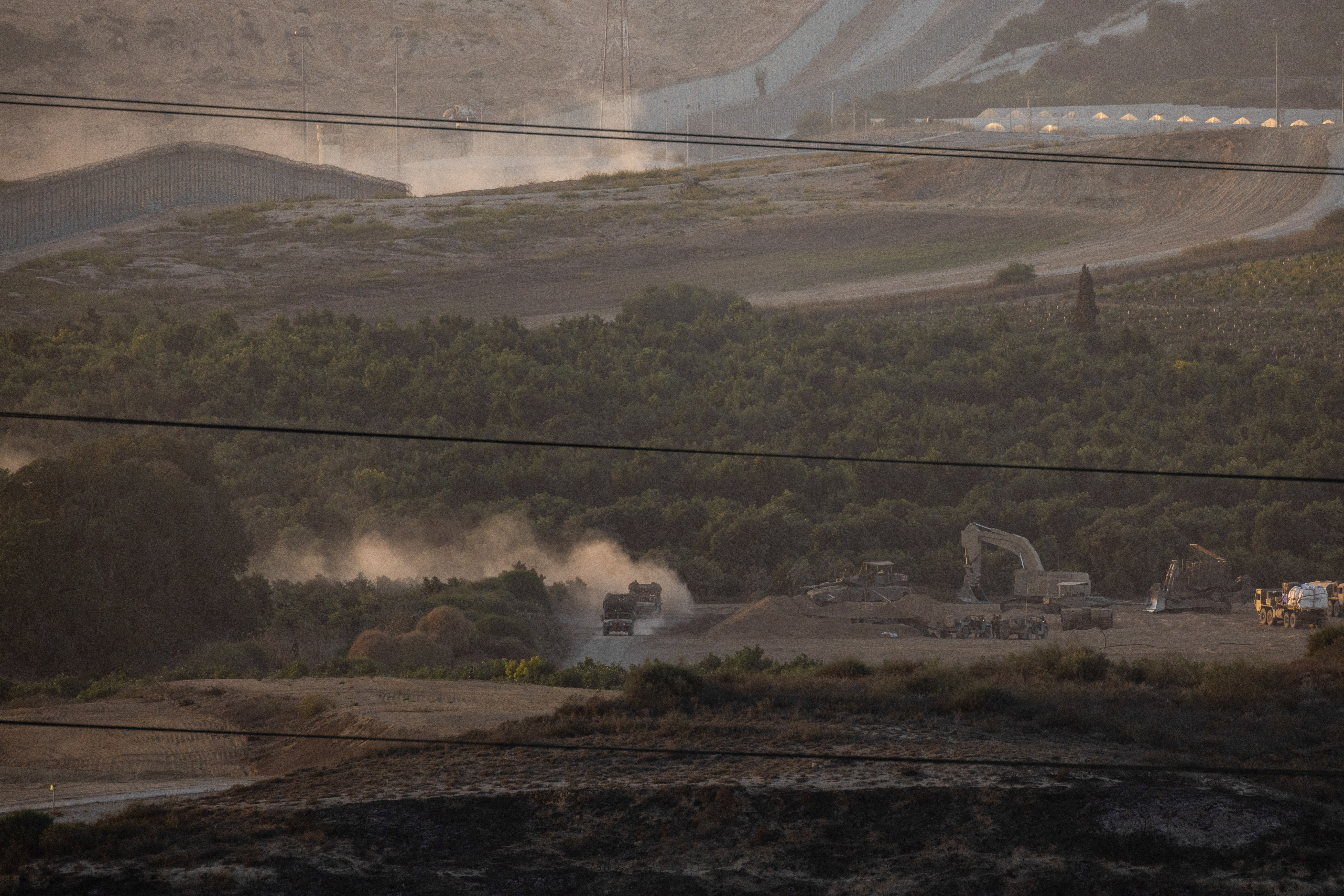 Israeli troops manoeuvre near the Israel-Gaza border, as seen from the southern Israel