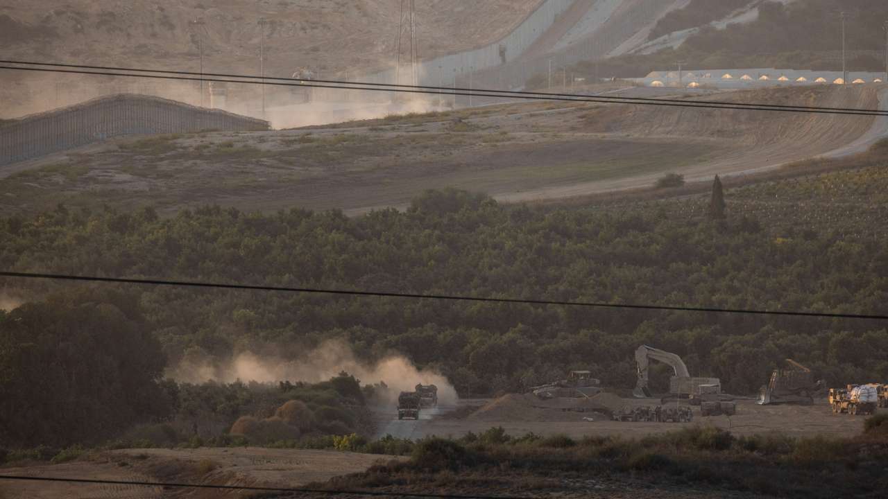 Israeli troops manoeuvre near the Israel-Gaza border, as seen from the southern Israel