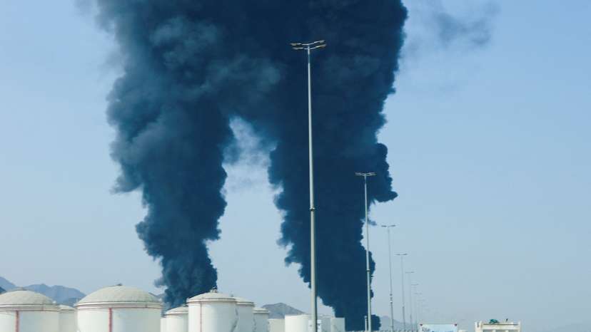 Smoke rises in the Fujairah oil industry zone, caused by debris after interception of a drone by air defenses, according to the Fujairah media office, amid the U.S.-Israel conflict with Iran, in Fujairah