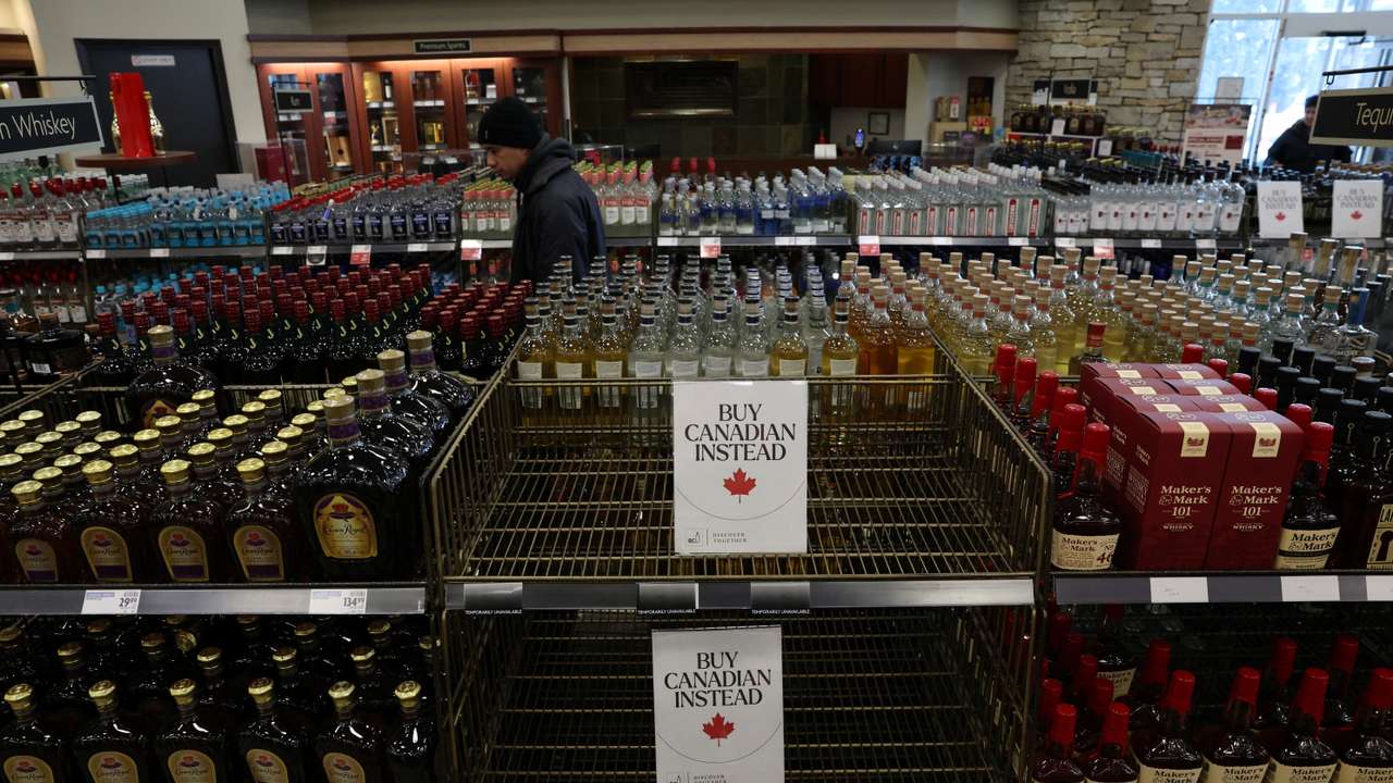 Empty shelves remain with signs ''Buy Canadian Instead'' after the top five U.S. liquor brands were removed from sale at a B.C. Liquor Store, in Vancouver
