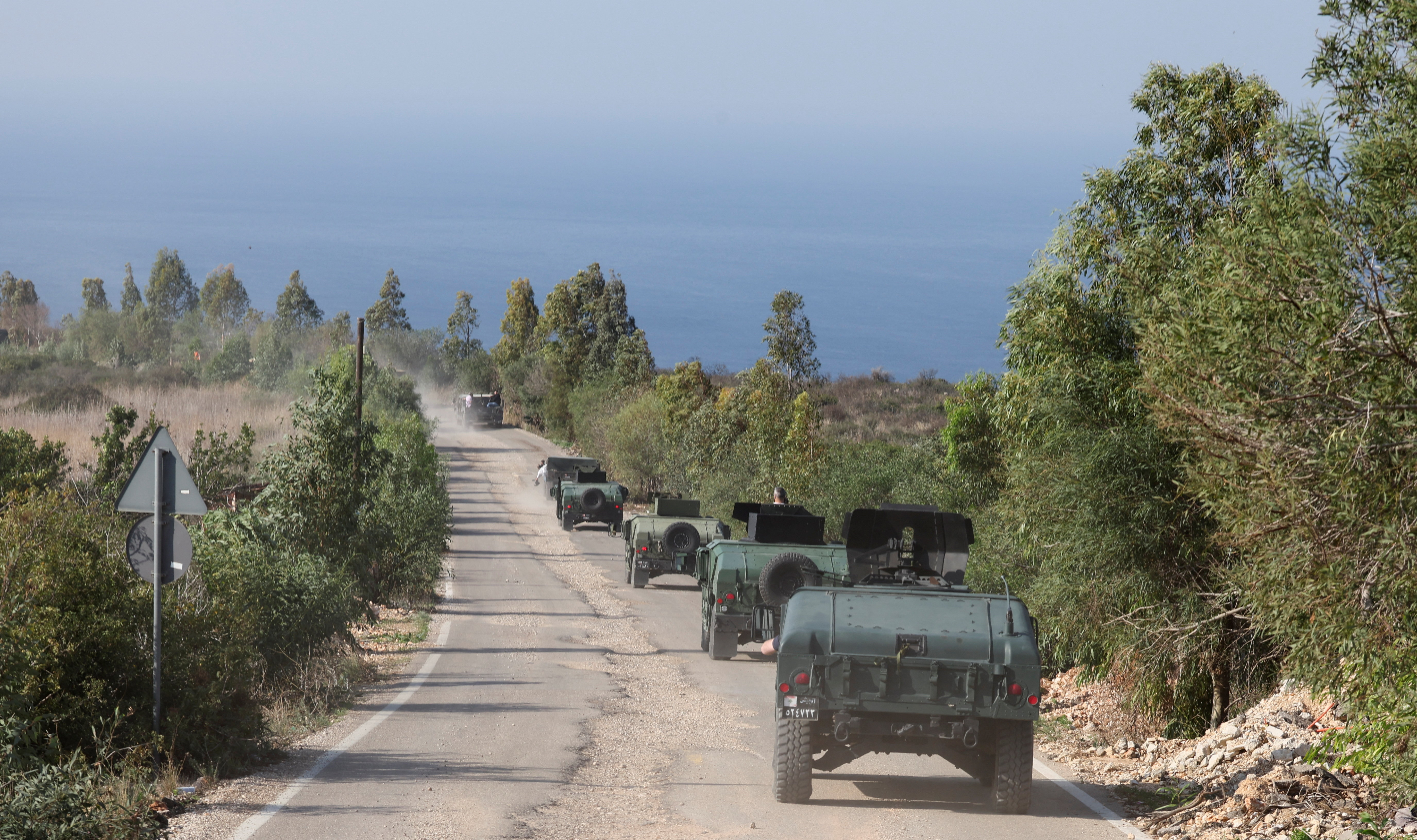 Lebanese army members drive military vehicles during a Lebanese army media tour, to review the army's operations in the southern Litani sector, in Naqoura