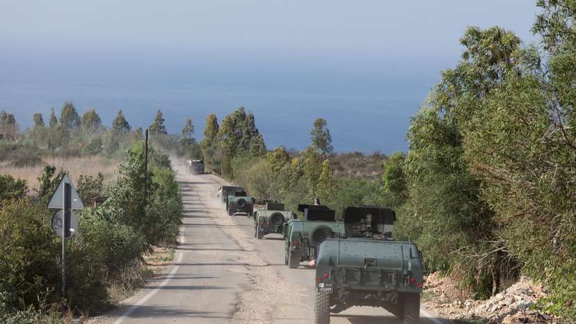 Lebanese army members drive military vehicles during a Lebanese army media tour, to review the army's operations in the southern Litani sector, in Naqoura