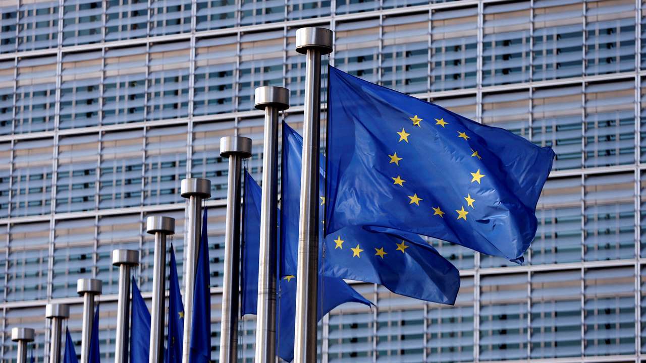 FILE PHOTO: EU flags flutter outside the EU Commission headquarters in Brussels