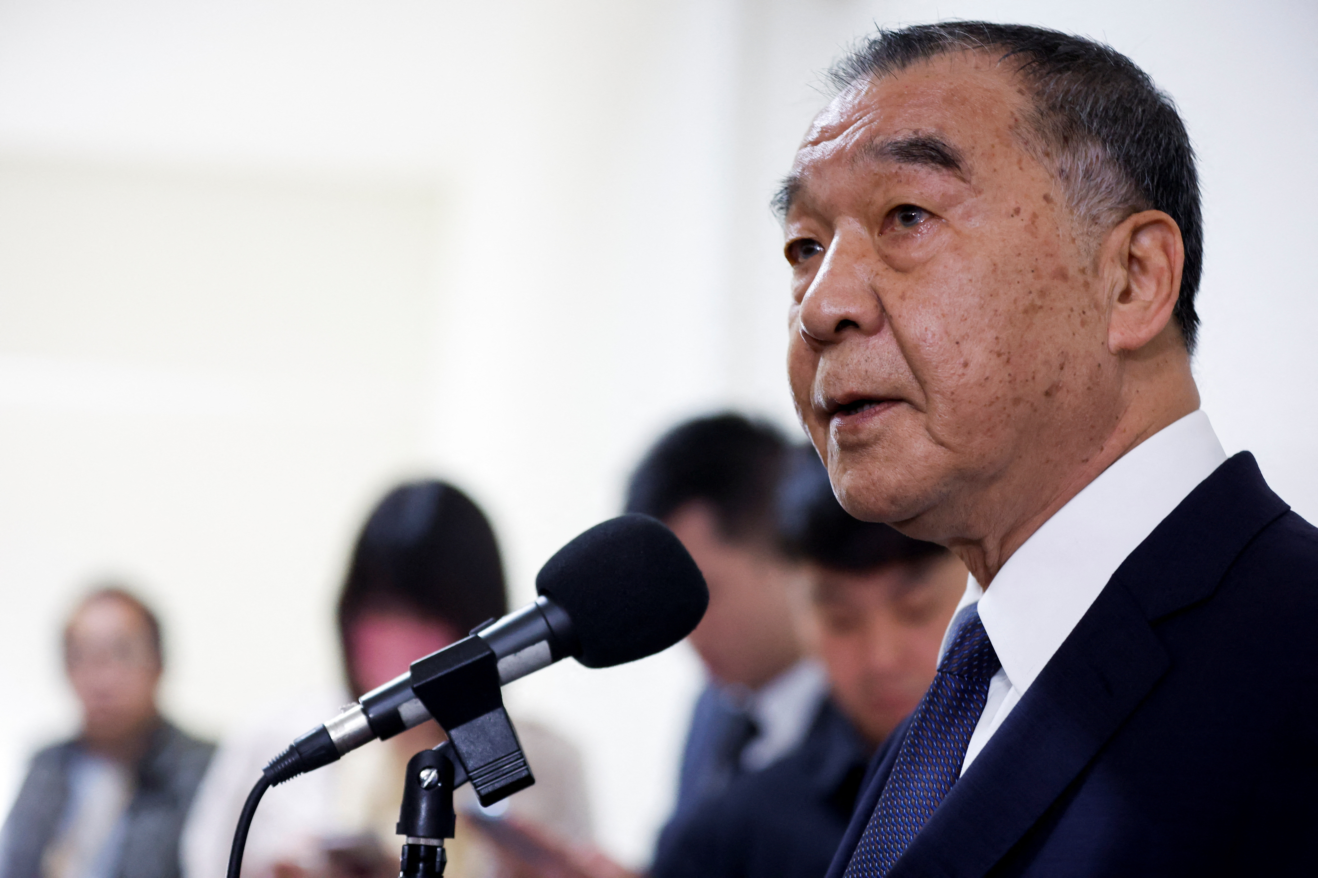 Taiwanese Defence Minister Chiu Kuo-cheng talks to the media before attending a parliament session in Taipei
