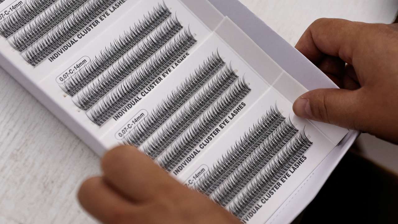 Worker works on a production line manufacturing false eyelashes at a workshop of Monsheery, in Pingdu