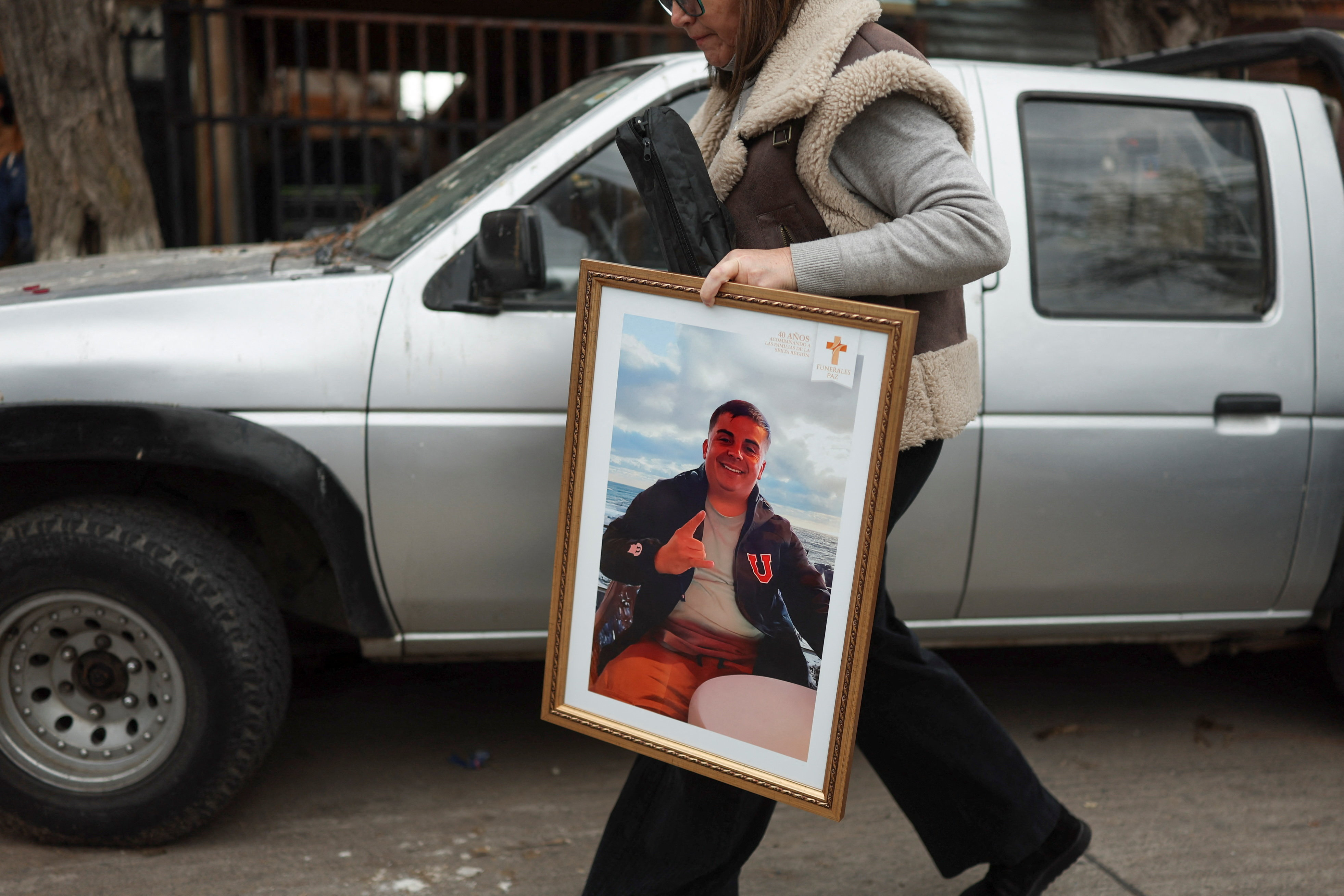 Family and friends welcome the body of Jean Miranda Ibaceta, at his neighbourhood after Chilean state-run copper producer Codelco confirmed the death of several miners who were trapped at El Teniente mine, in Rancagua