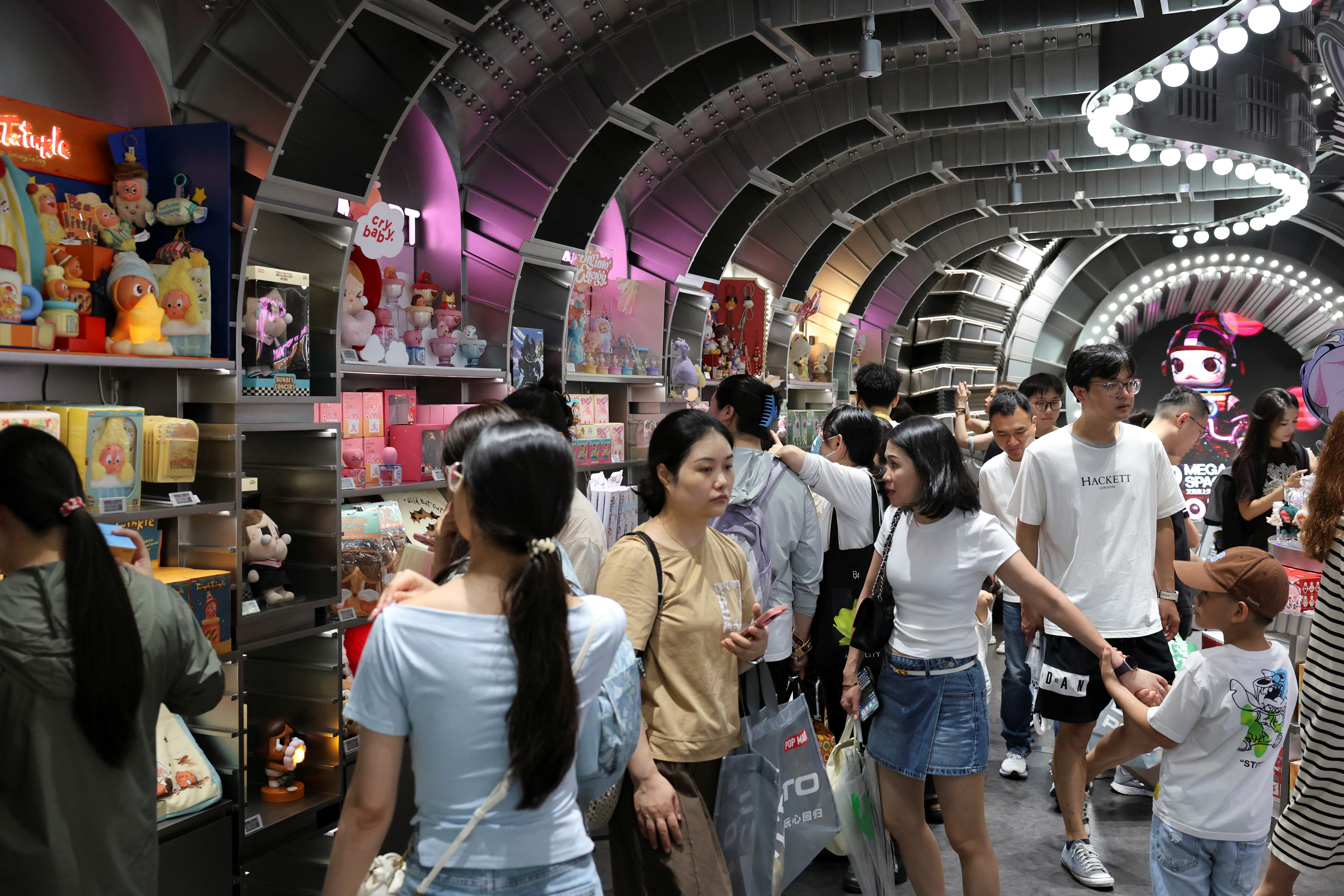 People visit the Pop Mart's flagship store in Shanghai