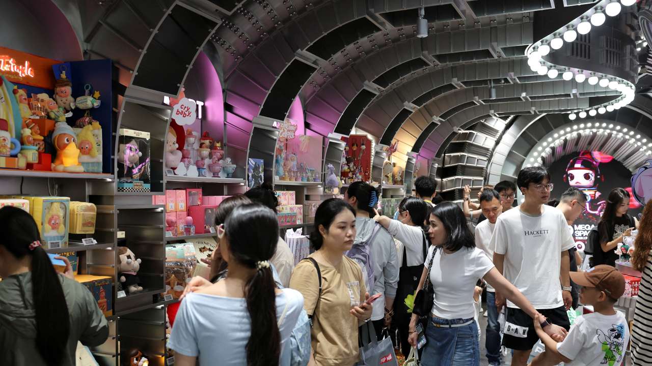 People visit the Pop Mart's flagship store in Shanghai