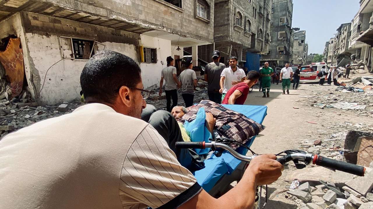 Palestinians evacuate Kamal Adwan hospital following an Israeli strike, in Beit Lahia