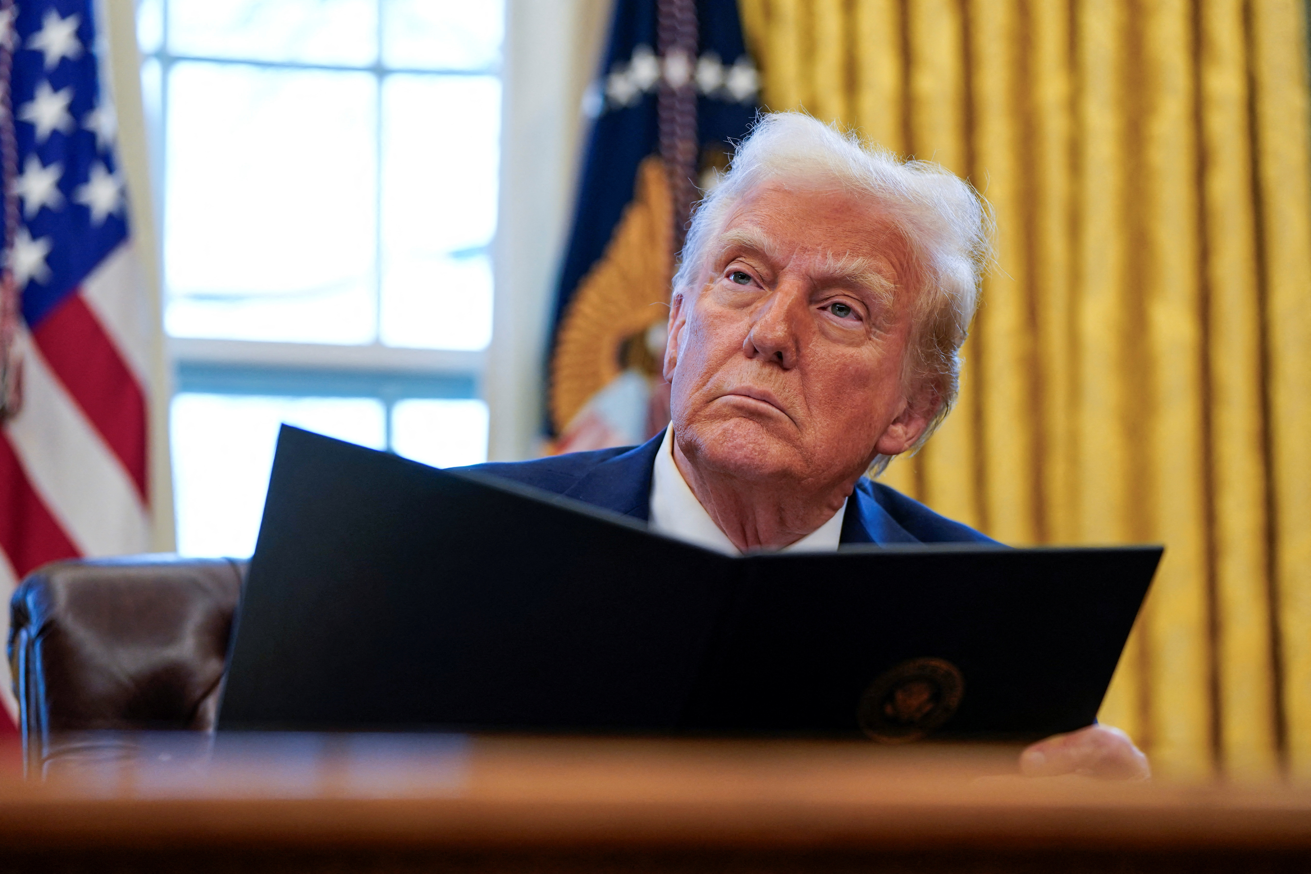 U.S. President Trump signs executive orders at the White House in Washington