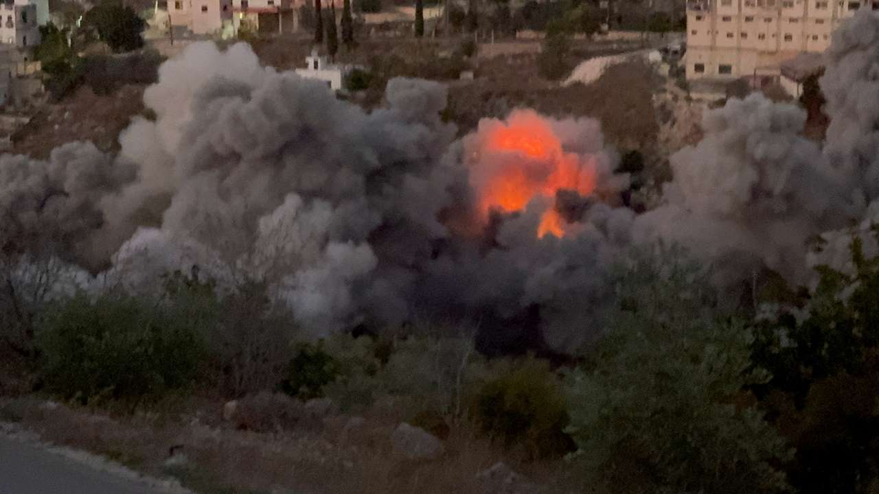 Smoke rises after Israeli strikes following Israeli military's evacuation orders, in Tayr Filsay