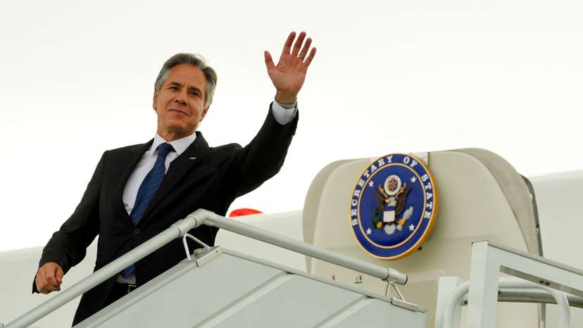 U.S. Secretary of State, Antony Blinken waves as he boards his plane at the Chopin Airport in Warsaw