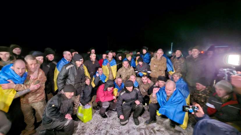 Ukrainian POWs pose after a swap at an unknown location in Ukraine