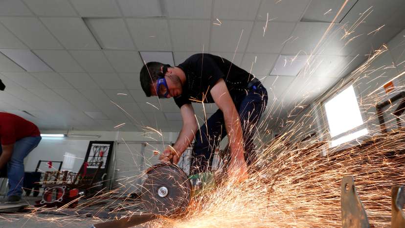 Syrian refugee metal shop trainees work at one of the vocational training centres of The Norwegian Refugee Council (NRC) at Azraq refugee camp