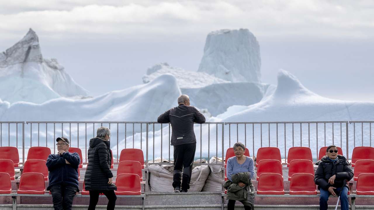 FILE PHOTO: Residents gather at a sports field in Qeqertarsuaq